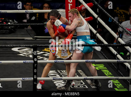Brooklyn, New York, USA. 21st Apr, 2018. HEATHER HARDY (white and blue trunks) and PAOLA TORRES battle in a featherweight bout at the Barclays Center in Brooklyn, New York. Credit: Joel Plummer/ZUMA Wire/Alamy Live News Stock Photo