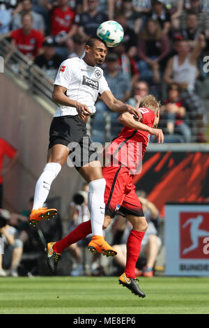 Frankfurt, Germany. 21st Apr, 2018. Sebastien Haller (L) of Eintracht Frankfurt heads the ball with Per Ciljan Skjelbred of Hertha BSC during the German Bundesliga match between Eintracht Frankfurt and Hertha BSC at the Commerzbank-Arena in Frankfurt, Germany, on April 21, 2018. Hertha BSC won 3-0. Credit: Ulrich Hufnagel/Xinhua/Alamy Live News Stock Photo