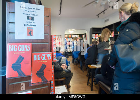 Rockville Centre, New York, USA. 20th Apr, 2018. On display at Turn of the Corkscrew Books & Wine store are copies of Rep. Steve Israel's newest novel BIG GUNS and a flyer with information about the special event about to start there for Nassau County debut of the former Congressman's (NY - Dem) book. BIG GUNS is a satire of the strong gun lobby, weak Congress, and a small Long Island town. Credit: Ann Parry/ZUMA Wire/Alamy Live News Stock Photo