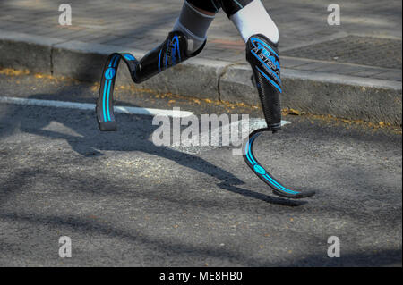 London, UK.  22 April 2018.  A runner wearing blades passes through mile 13, near Tower Bridge, during the 2018 London Marathon. Credit: Stephen Chung / Alamy Live News Stock Photo