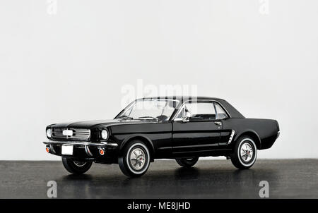 Izmir, Turkey - April 17, 2015. Ford Mustang 260 model car product shot. Left side view on a white background and on a dust ground. Stock Photo