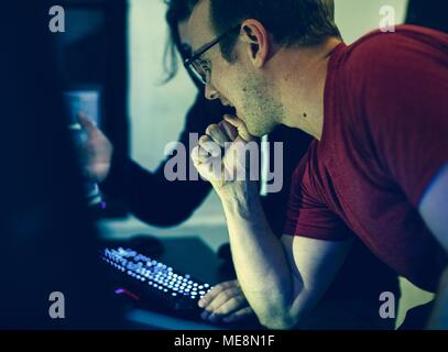 Programmers working on computer program Stock Photo