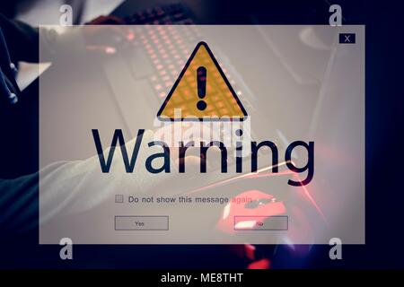 Computer with warning pop up sign window Stock Photo