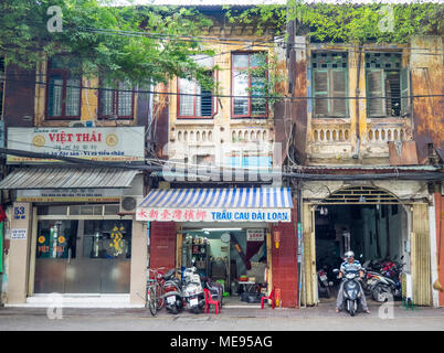 Rundown facade of a French colonial shophouse in Ho Chi Minh City, Vietnam Stock Photo