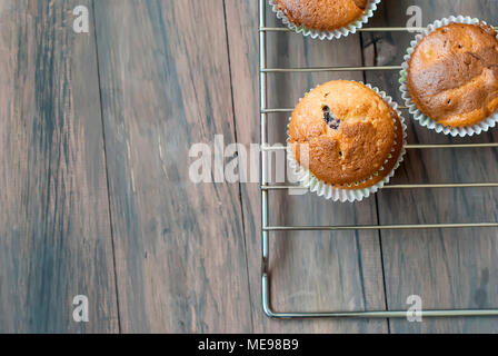 chocolate and vanilla  homemade muffins on a dark wooden background  bakery concept. Stock Photo