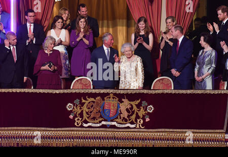 Queen Elizabeth II, surrounded by members of the royal family, takes her seat at the Royal Albert Hall in London to attend a star-studded concert to celebrate her 92nd birthday. Stock Photo
