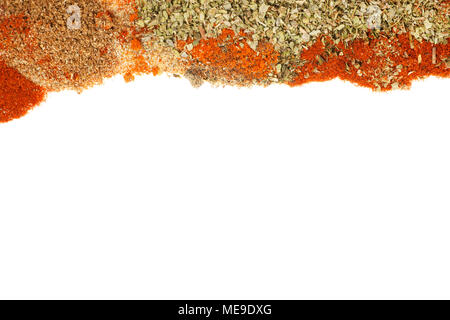 Different spices and herbs laying on white background as border. Texture and template Stock Photo