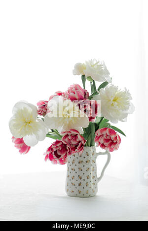 Tulips and Peonies in a pitcher Stock Photo