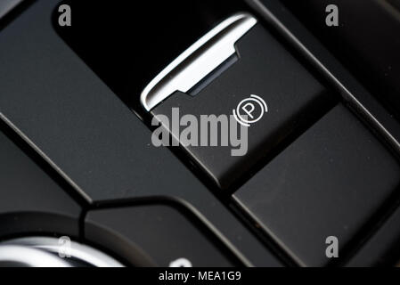 Close up of a car electronic parking brake button Stock Photo