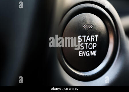 Start stop engine modern new car button Stock Photo