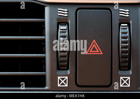 Emergency stop button in car. Warning of the danger and stop. Stock Photo