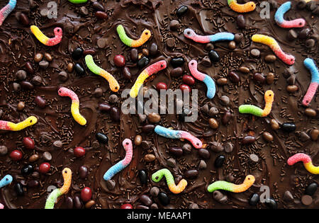 Chocolate icing with candy background Stock Photo