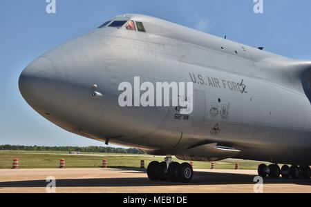 A U.S. Air Force C-5 Galaxy cargo plane on a runway at Columbus Air Force Base. This C-5 belongs to 436th Airlift Wing and 512th Airlift Wing Stock Photo