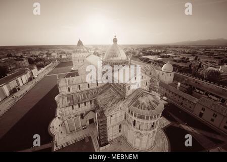 Cathedral viewed from top of Pisa leaning tower at sunset wide angle view Stock Photo