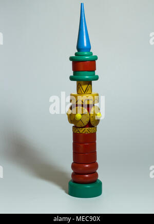 Children's toy in assembled form stands on a gray background Stock Photo