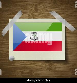 Flags of Equatorial Guinea at frame on wooden texture. Vector illustration Stock Vector