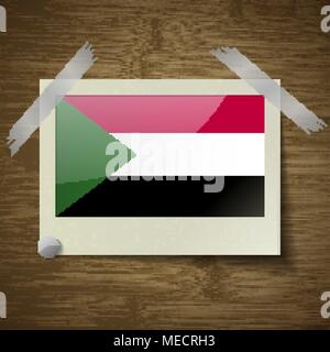 Flags of Sudan at frame on wooden texture. Vector illustration Stock Vector