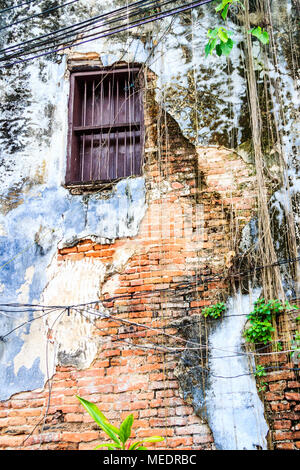 Exposed brickwork on old house, Chinatown, Bangkok, Thailand Stock Photo