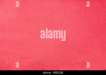 Background texture of red fleece. Plush velour closeup. Stock Photo