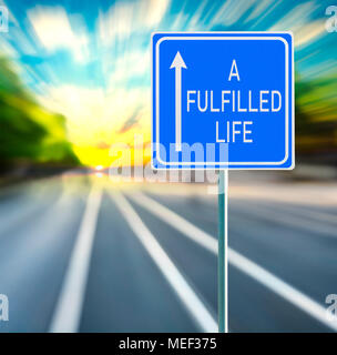 A Fulfilled Life Road Sign on a Speedy Background with Sunset. Stock Photo