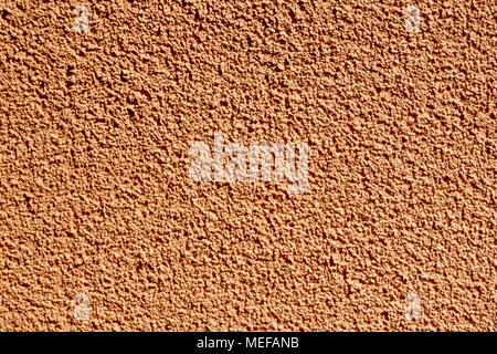 Facade stone plaster background in terracotta color Stock Photo