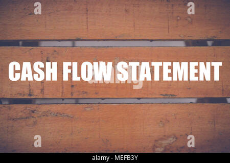 cash flow statement written on wood background Stock Photo