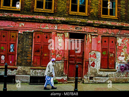 Red Windows and Shutters on a run-down London Street Stock Photo