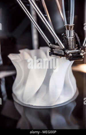 3D printer printing, also known as additive manufacturing (AM), refers to processes used to create a three-dimensional object in which layers of mater Stock Photo