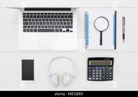 Office desk table with laptop, smartphone, and office supplies. Flat lay, arrangement composition Stock Photo