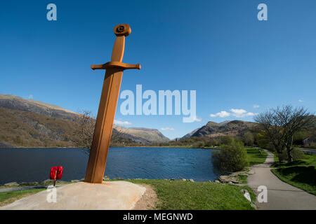 A 20 foot high iron sculpture of King Arthurs Excalibur stands beside Llyn Padarn in the village of Llanberis, North Wales. Stock Photo