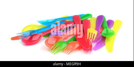 Multi colored plastic cutlery on a white background Stock Photo