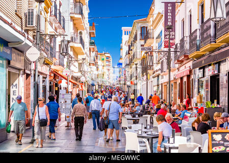 RONDA, SPAIN - OCTOBER 5, 2014: Crowds walk on Calle La Bola pedestrian shopping street in Ronda. Stock Photo