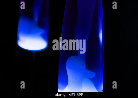 Lava lamp reflection. Abstract isolated composition on black background Stock Photo