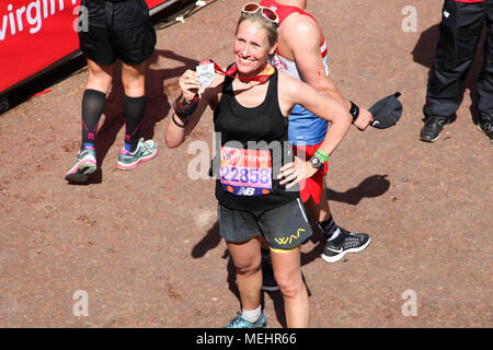 London, UK, 22 April 2018. Marathon Runner with her finishers medal Credit: Alex Cavendish/Alamy Live News Stock Photo