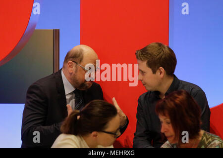 Wiesbaden, Germany. 22nd April 2018. Kevin Kühnert (right), the Chairman of the Jusos, the youth organisation of the SPD, talks with Martin Schulz (left), the former chairman of the SPD and former President of the European Parliament, at the party convention. Andrea Nahles, the leader of the parliamentary party of the SPD in the Bundestag (German Parliament) has been elected as the new chairwoman of the SPD (Social Democratic Party of Germany). Credit: Michael Debets/Alamy Live News Credit: Michael Debets/Alamy Live News Stock Photo