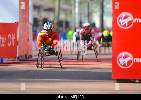 London, UK. 22nd Apr, 2018. Dai Yungqiang (CHI) crossing the finish line on The Mall during the Virgin Money London Marathon Men's Wheelchair race, The Mall, London, United Kingdom.  Yungqiang finished in 15th place with a time of 01:36:08. Credit: Michael Preston/Alamy Live News Stock Photo