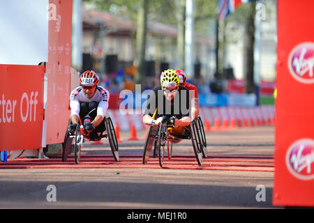 London, UK. 22nd Apr, 2018. Heinz Frei (SUI, left) and Rafael Botello Jiménez (ESP, right) crossing the finish line on The Mall during the Virgin Money London Marathon Men's Wheelchair race, The Mall, London, United Kingdom.  Both had the same time of 01:36:10 but Botello Jiménez finished in 17th place and Frei in 18th. Credit: Michael Preston/Alamy Live News Stock Photo