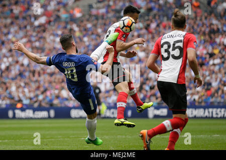 London, UK. 22nd Apr, 2018. Chelsea's Olivier Giroud (L) attempts a shot which is blocked by Southampton's Maya Yoshida (C) as Southampton's Jan Bednarek looks during the FA Cup semifinal between Chelsea and Southampton at Wembley Stadium in London, Britain on April 22, 2018. Chelsea won 2-0 and advanced to the final. Credit: Tim Ireland/Xinhua/Alamy Live News Stock Photo