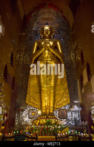 One of the four Buddha statues ('Kakusandha', north facing) inside the 'Ananda Temple'. Bagan, Myanmar (Burma). Stock Photo
