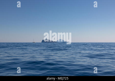 View of the Aeolian islands Panarea and Stromboli shot over the horizon Stock Photo