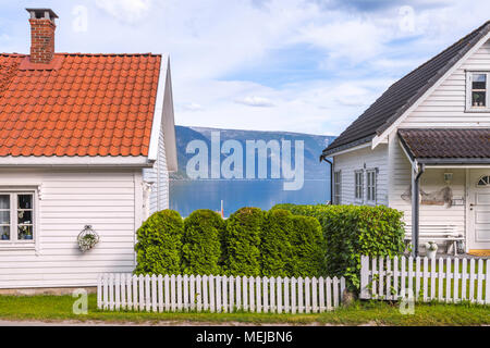 view to the fjord and wooden houses, Norway, Solvorn at the Sognefjorden, idyllic village on the shore on the west side of the Lustrafjorden Stock Photo