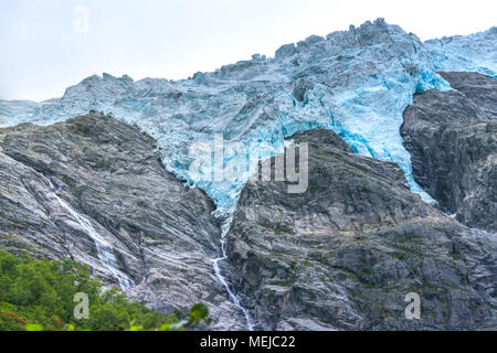 glacier Supphellebreen, close up, part of Jostedal National Park, Norway, near Fjaerland, blue shimmering glacial ice in a rough mountain landscape Stock Photo