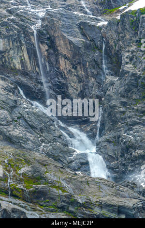 cascades and waterfall at glacier Supphellebreen, part of the Jostedalsbreen National Park, Norway, near Fjaerland, steeply sloping rock faces Stock Photo