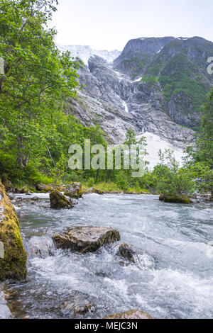 glacier Supphellebreen and its river, part of the Jostedalsbreen  National Park, Norway, near Fjaerland, riverscape with rocks Stock Photo