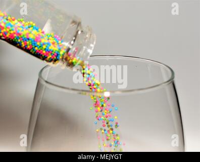 Pouring Colorful Sprinkles Stock Photo