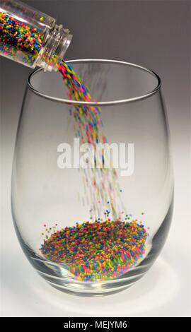 Pouring Colorful Sprinkles Stock Photo
