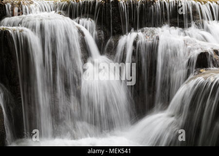 Full frame close-up of a cascade at the Tat Kuang Si Waterfalls near Luang Prabang in Laos. Natural abstract art. Stock Photo
