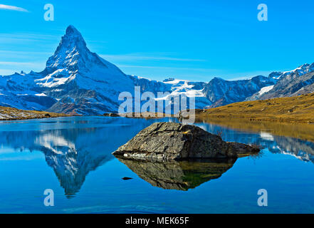 The Matterhorn, Mont Cervin, is reflected in lake Stellisee, Zermatt, Valais, Switzerland