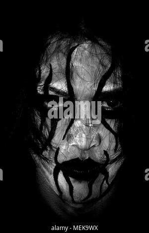 Dark Man With White Face Paint Stock Photo - Download Image Now