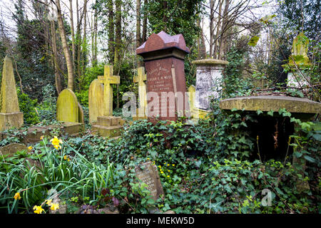 Tilted gravestones at Abney Park cemetery, one of the Magnificent Seven cemeteries in London, UK Stock Photo